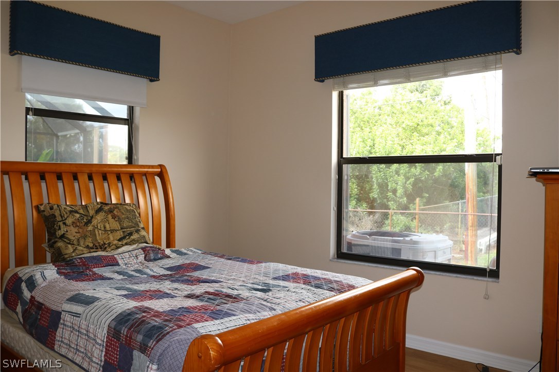 18432 Olive Road Fort Myers, FL 33967 - Photo 10 of 18 a bedroom with a bed and window