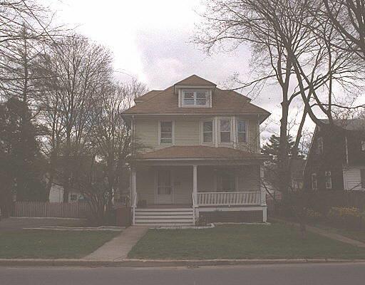 a front view of a house with a garage
