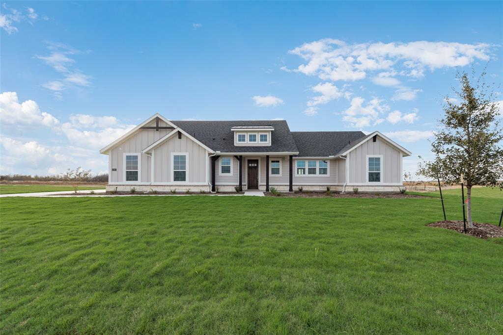 1230 County Road 200 Valley View, TX 76272 - Photo 1 of 26 Modern farmhouse with a shingled roof, board and batten siding, covered porch, and a front lawn