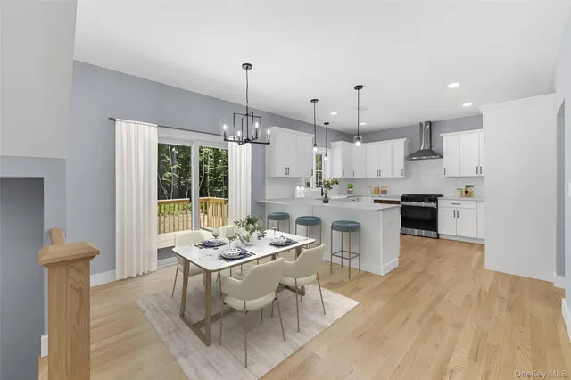 a kitchen with a table and chairs in it