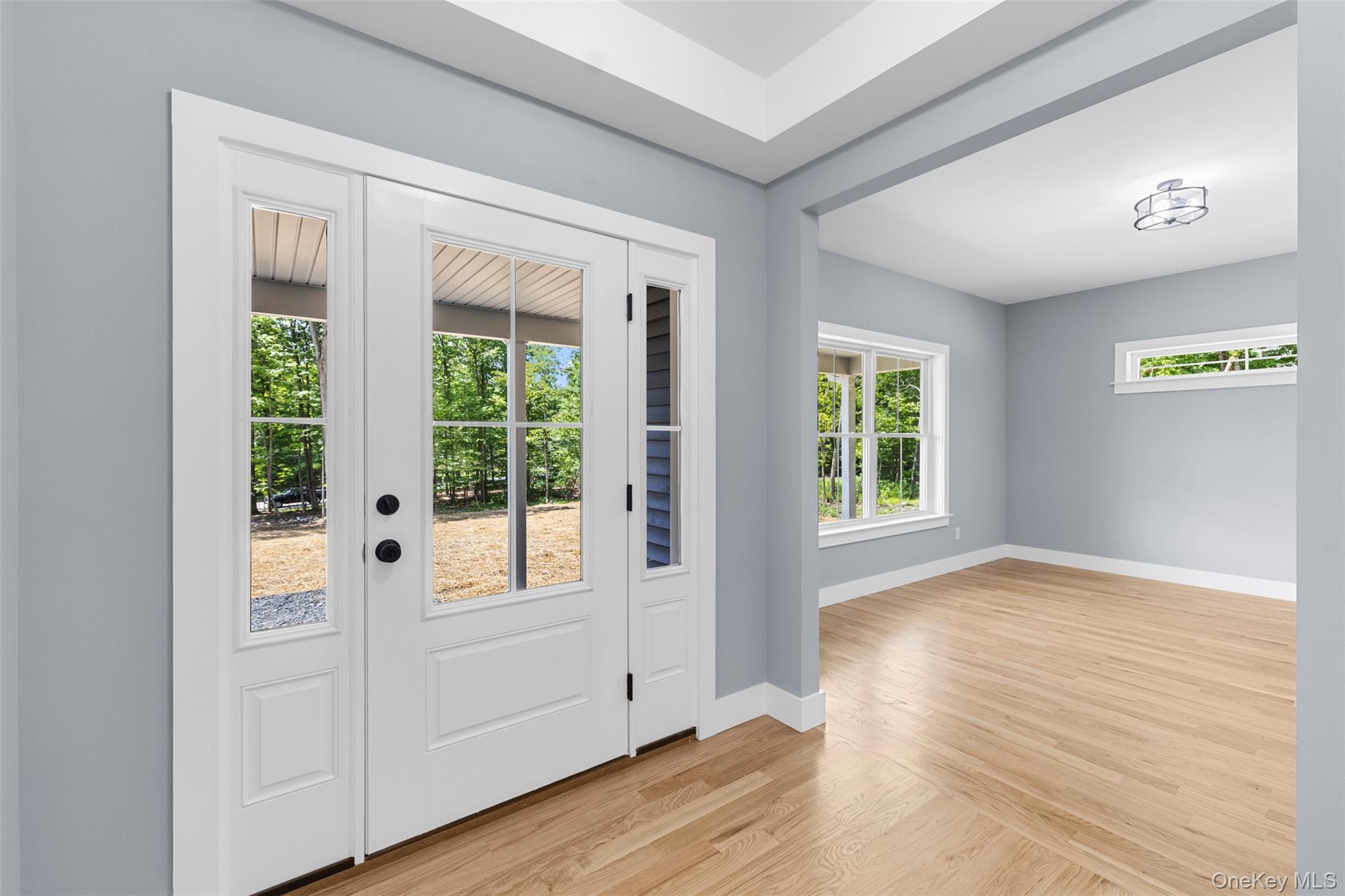 264 Lybolt Road Middletown, NY 10941 - Photo 13 of 45 a view of an empty room with wooden floor and a window