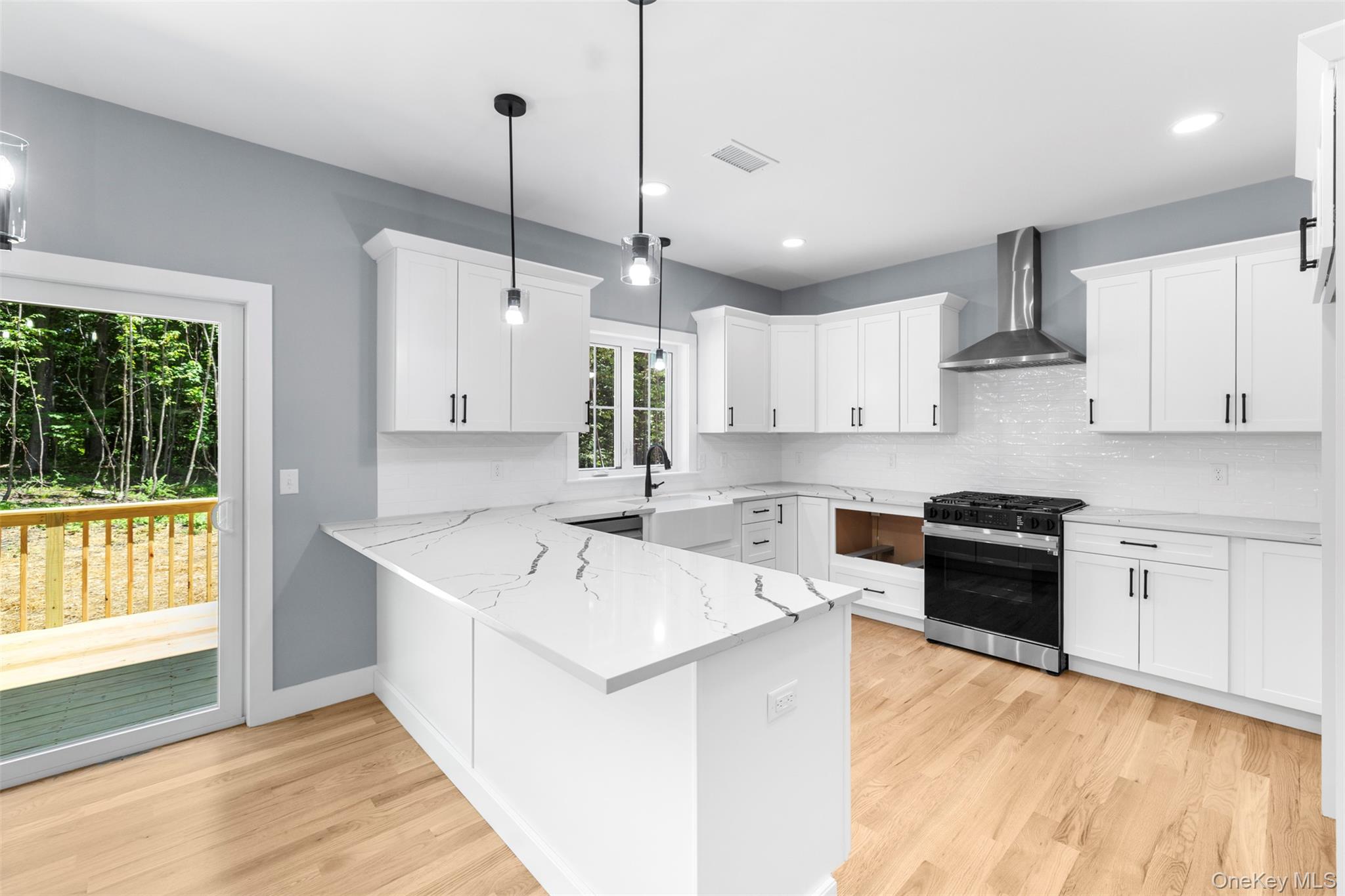 264 Lybolt Road Middletown, NY 10941 - Photo 22 of 45 a kitchen with stainless steel appliances kitchen island a sink a stove and a window
