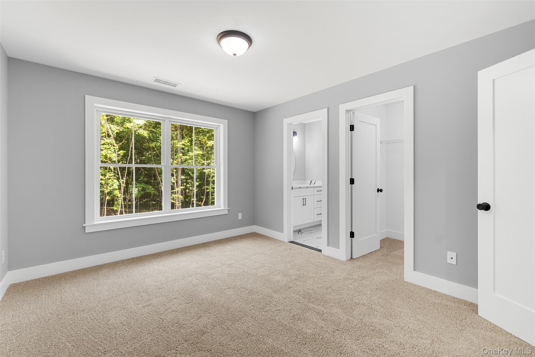 264 Lybolt Road Middletown, NY 10941 - Photo 36 of 45 an empty room with a window and a ceiling fan