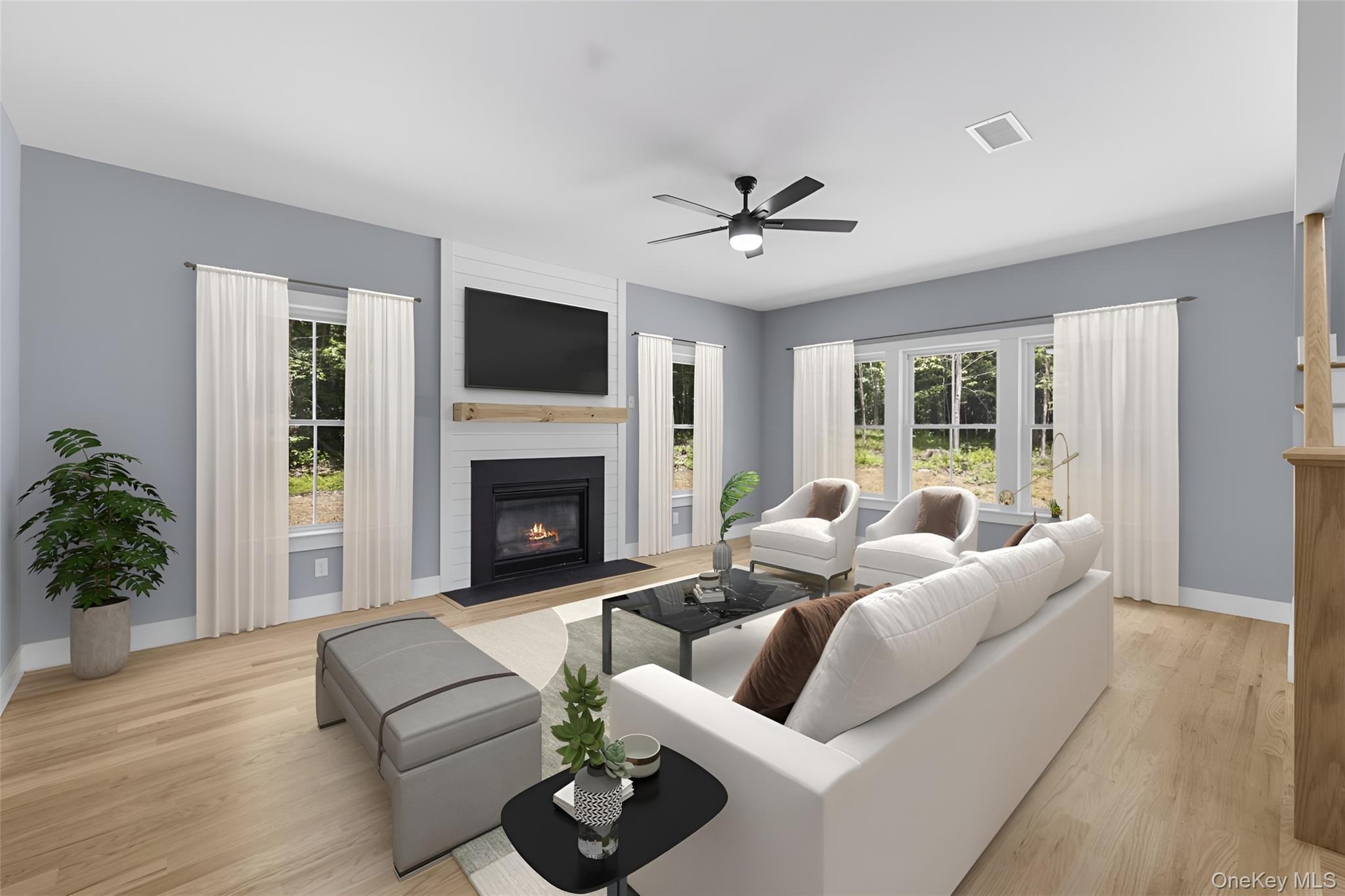 264 Lybolt Road Middletown, NY 10941 - Photo 10 of 45 a living room with furniture a fireplace and a flat screen tv