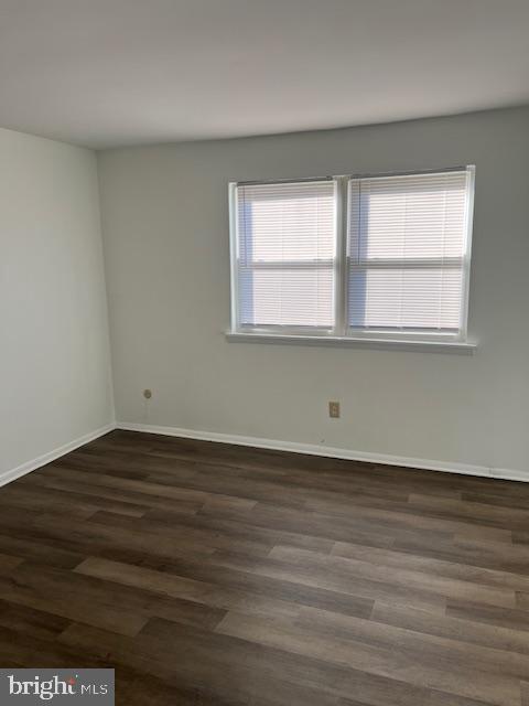 10-3 Florence Tollgate Florence, NJ 08518 - Photo 11 of 17 a view of an empty room with wooden floor and a window
