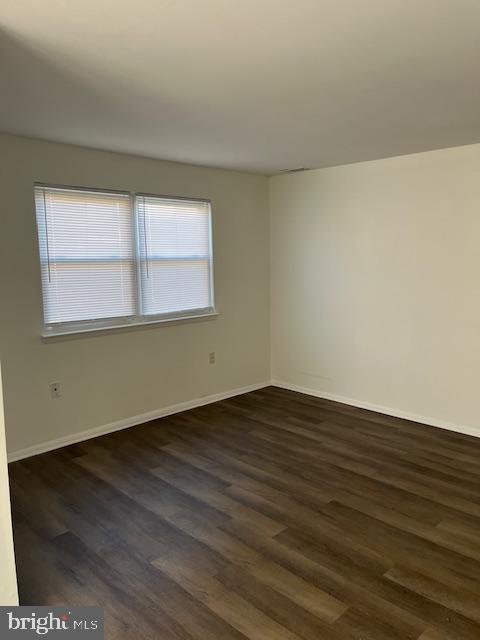 10-3 Florence Tollgate Florence, NJ 08518 - Photo 5 of 17 an empty room with wooden floor and windows