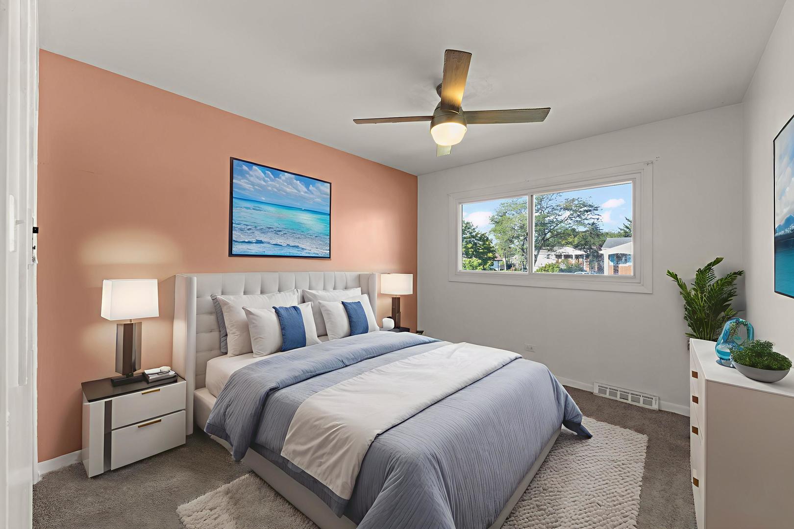 18749 Loomis Avenue Homewood, IL 60430 - Photo 16 of 41 a bedroom with a large bed and a chandelier