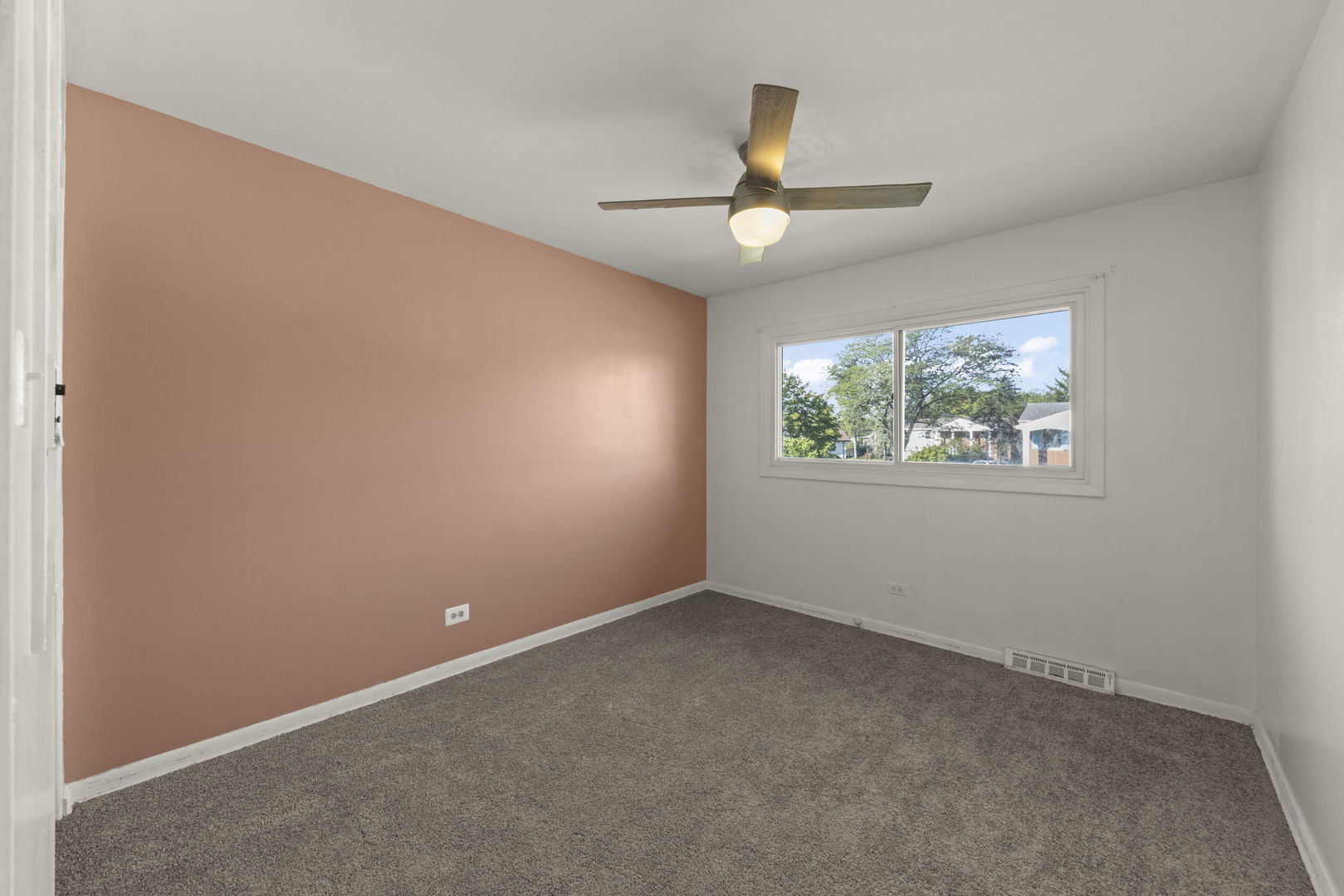 18749 Loomis Avenue Homewood, IL 60430 - Photo 17 of 41 an empty room with a window and a ceiling fan