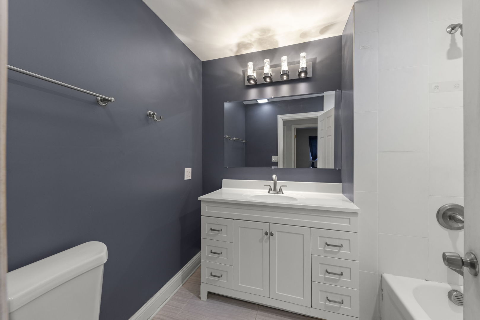 18749 Loomis Avenue Homewood, IL 60430 - Photo 18 of 41 a bathroom with a sink and a mirror