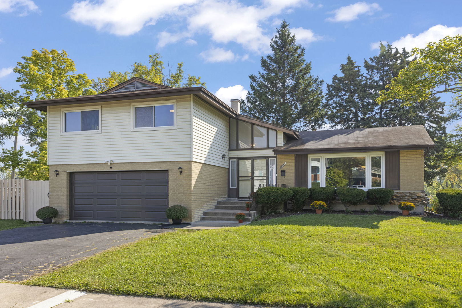 18749 Loomis Avenue Homewood, IL 60430 - Photo 2 of 41 a front view of a house with garden