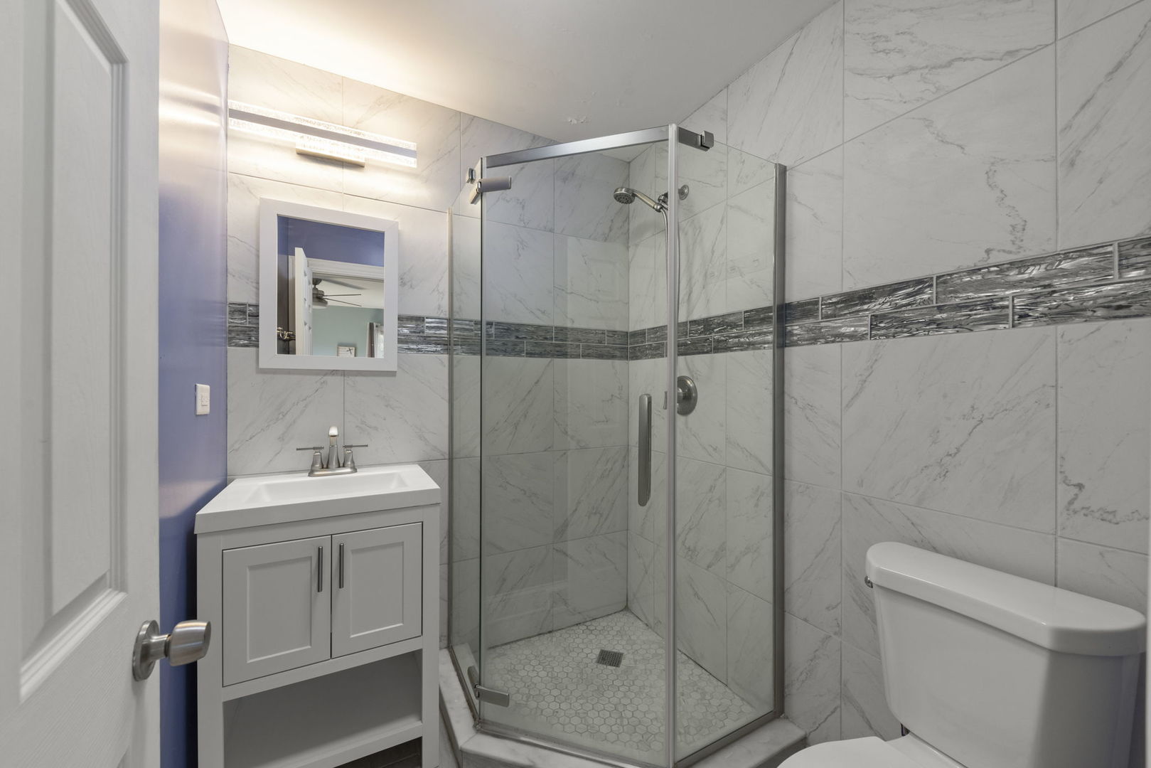 18749 Loomis Avenue Homewood, IL 60430 - Photo 22 of 41 a bathroom with a shower sink mirror and toilet