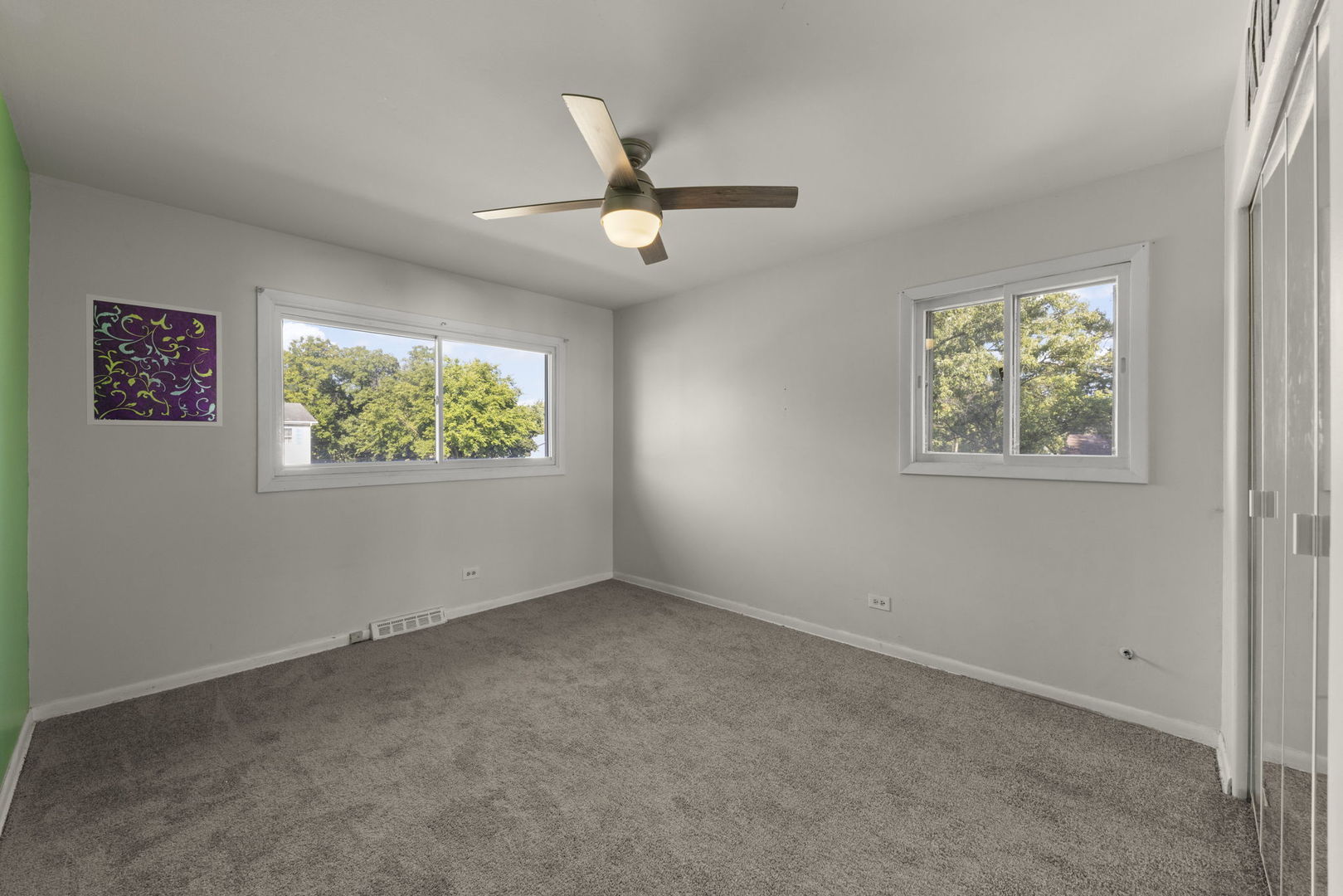 18749 Loomis Avenue Homewood, IL 60430 - Photo 26 of 41 an empty room with windows and ceiling fan