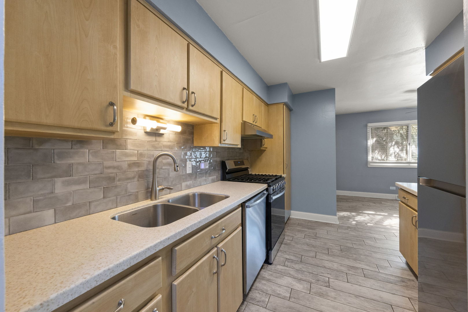 18749 Loomis Avenue Homewood, IL 60430 - Photo 3 of 41 a kitchen with a sink cabinets and a wooden floor