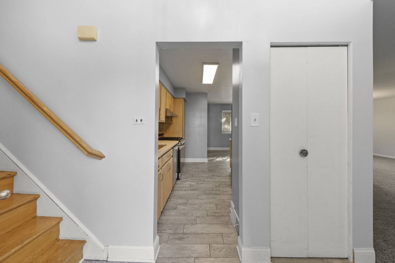 18749 Loomis Avenue Homewood, IL 60430 - Photo 5 of 41 a view of a hallway with wooden floor and staircase