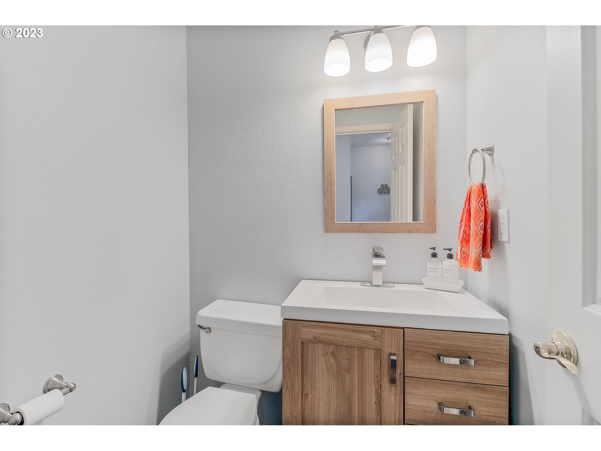 10335 Southwest Denney Road Beaverton, OR 97008 - Photo 18 of 31 a bathroom with a sink vanity and a toilet