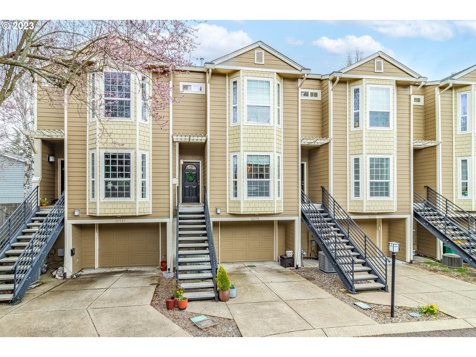 10335 Southwest Denney Road Beaverton, OR 97008 - Photo 2 of 31 a front view of a residential apartment building with a yard