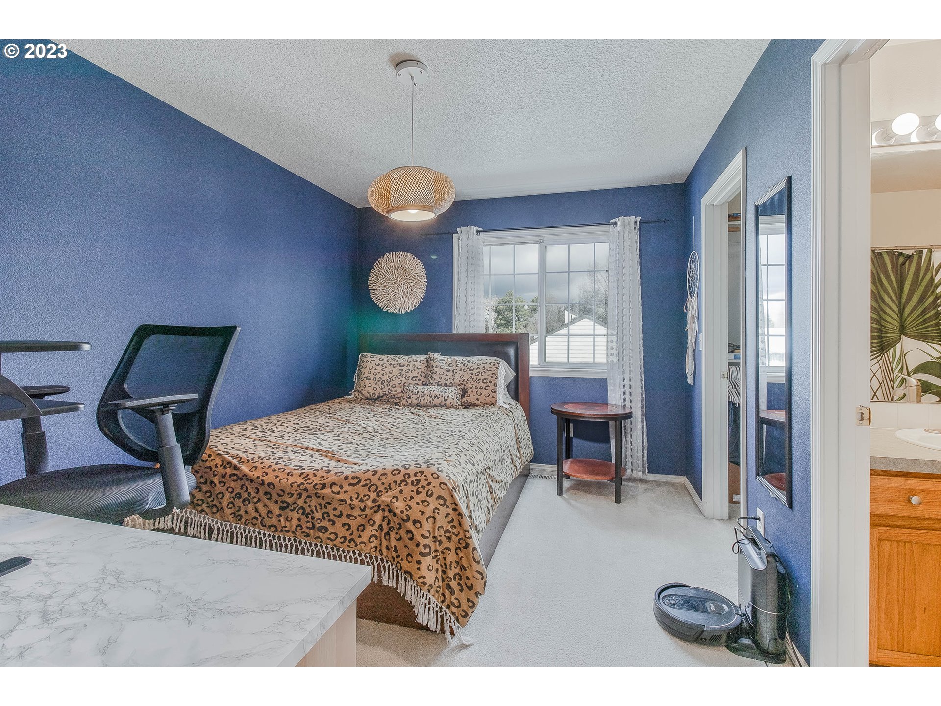 10335 Southwest Denney Road Beaverton, OR 97008 - Photo 22 of 31 a bedroom with a bed mirror and a window
