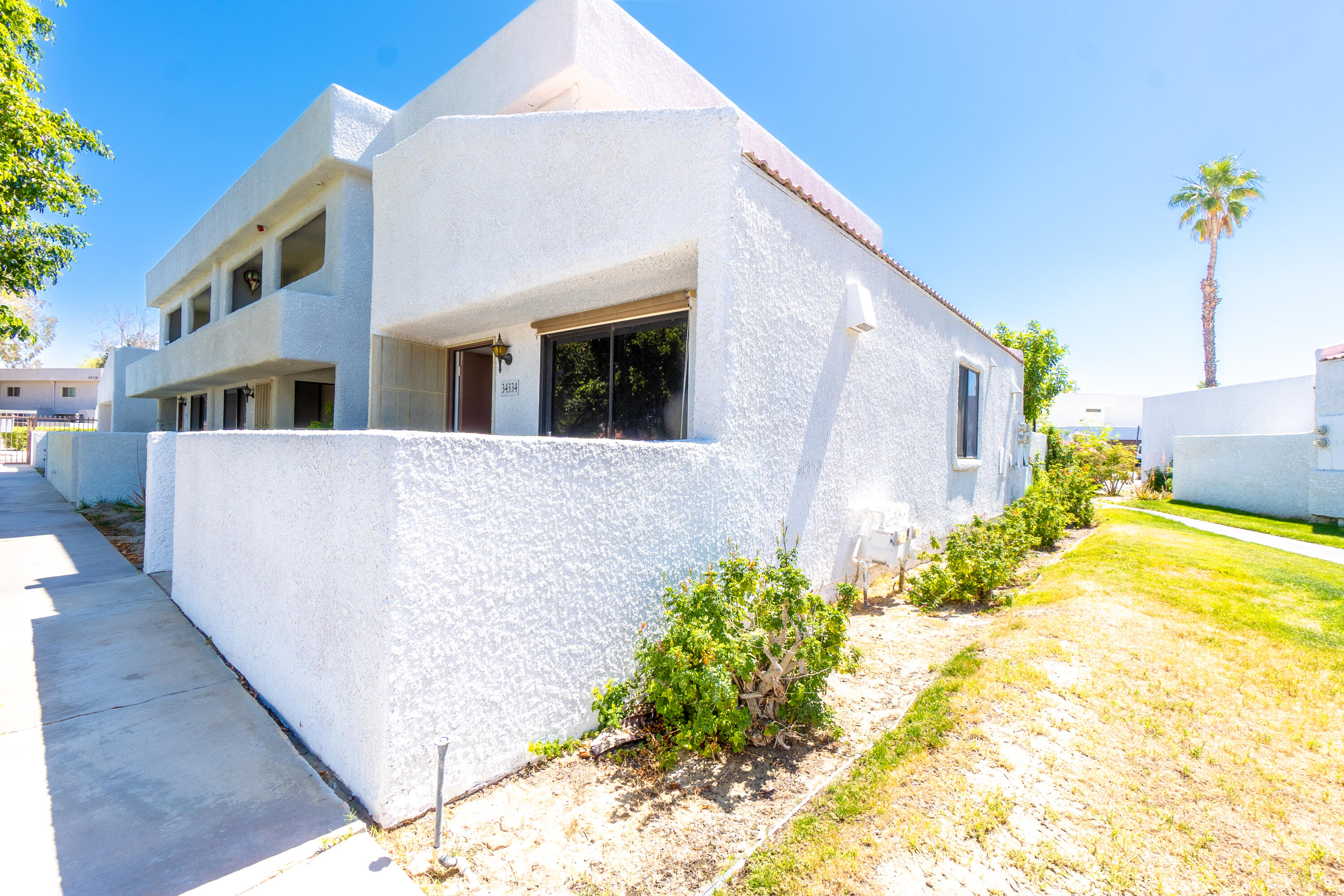 34334 Laura Way Rancho Mirage, CA 92270 - Photo 23 of 27 a view of a house with a backyard