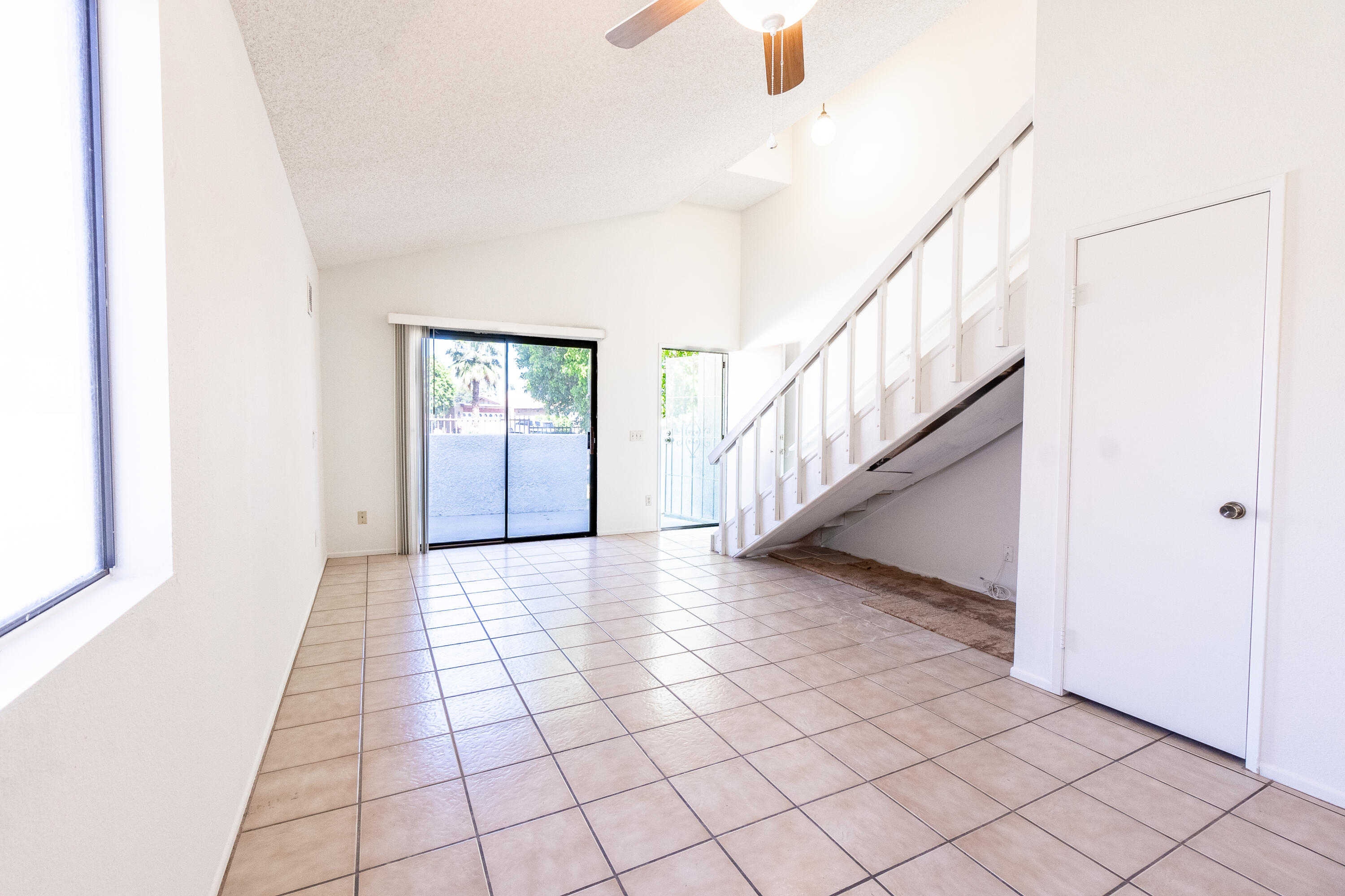 34334 Laura Way Rancho Mirage, CA 92270 - Photo 4 of 27 a view of entryway with stairs and wooden floor