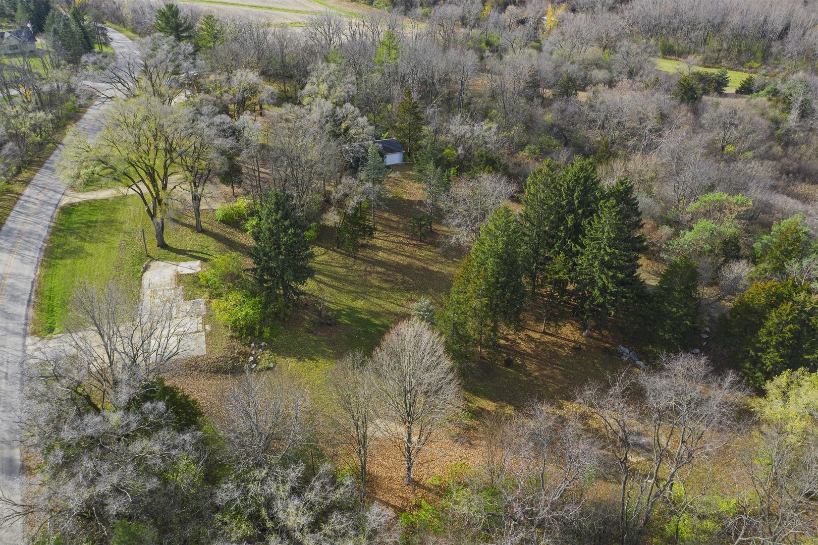 10182 Hamborg Road Roscoe, IL 61073 - Photo 14 of 23 a backyard of a house with a yard and outdoor seating