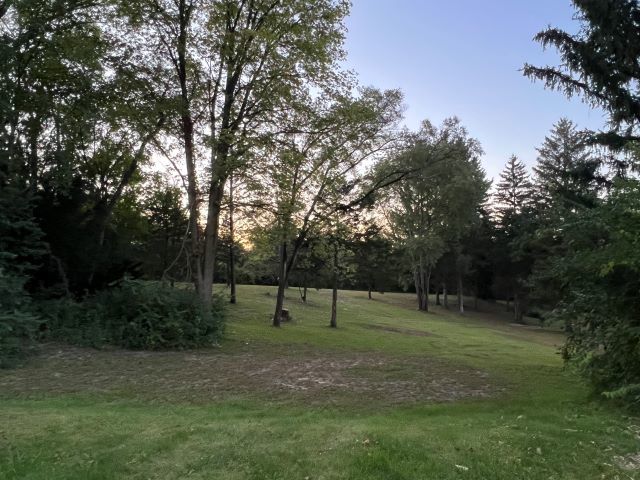 10182 Hamborg Road Roscoe, IL 61073 - Photo 23 of 23 a view of outdoor space with trees all around