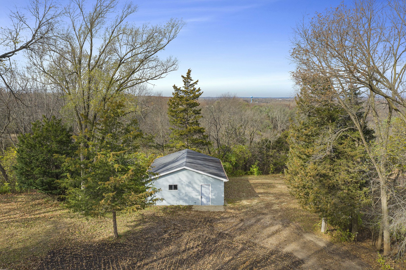 10182 Hamborg Road Roscoe, IL 61073 - Photo 8 of 23 a wooden house with trees in front of it