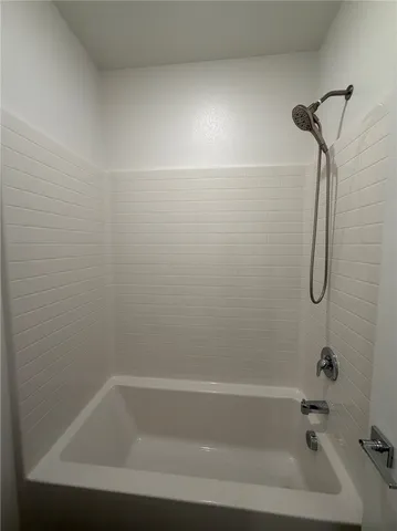 a close up of a bathtub in a bathroom