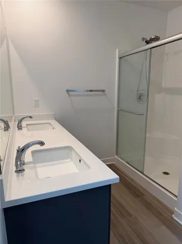 a bathroom with a sink and mirror