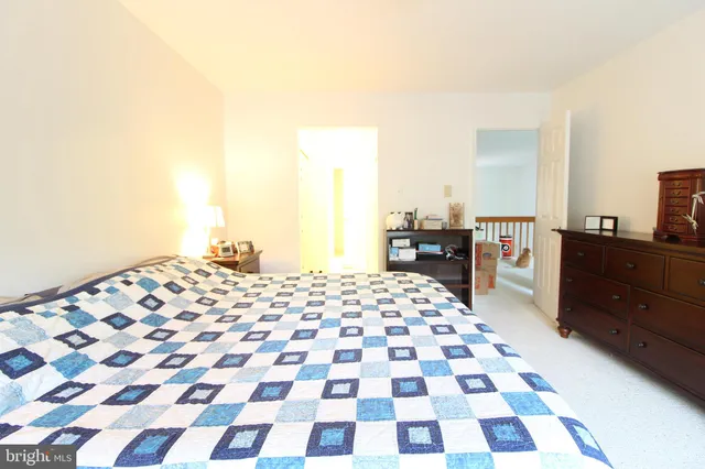 a living room with a black white checkered floor with a black white checkered floor