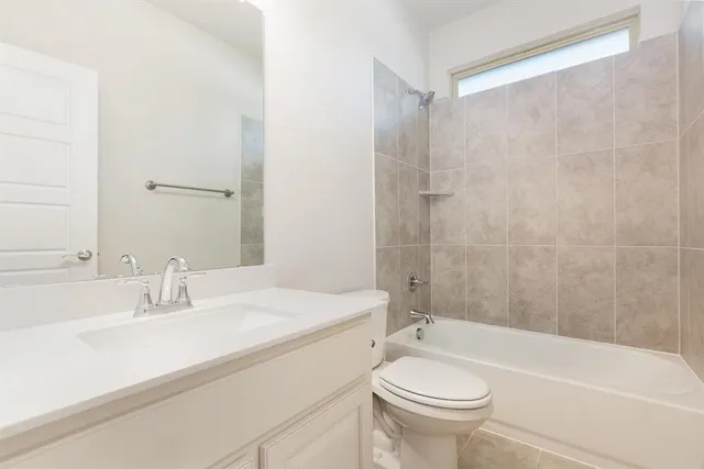 a bathroom with a sink a toilet and a bathtub