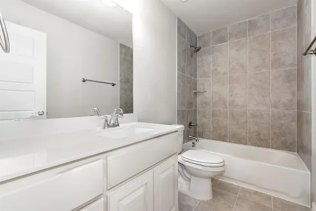 a bathroom with a sink a toilet and a bathtub