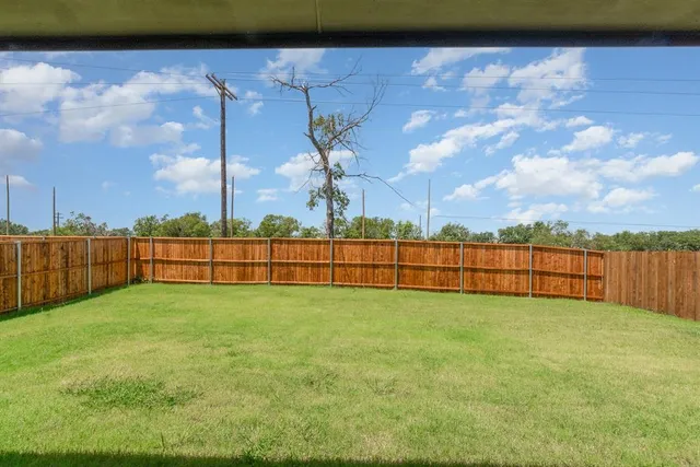 a view of a yard with an outdoor space