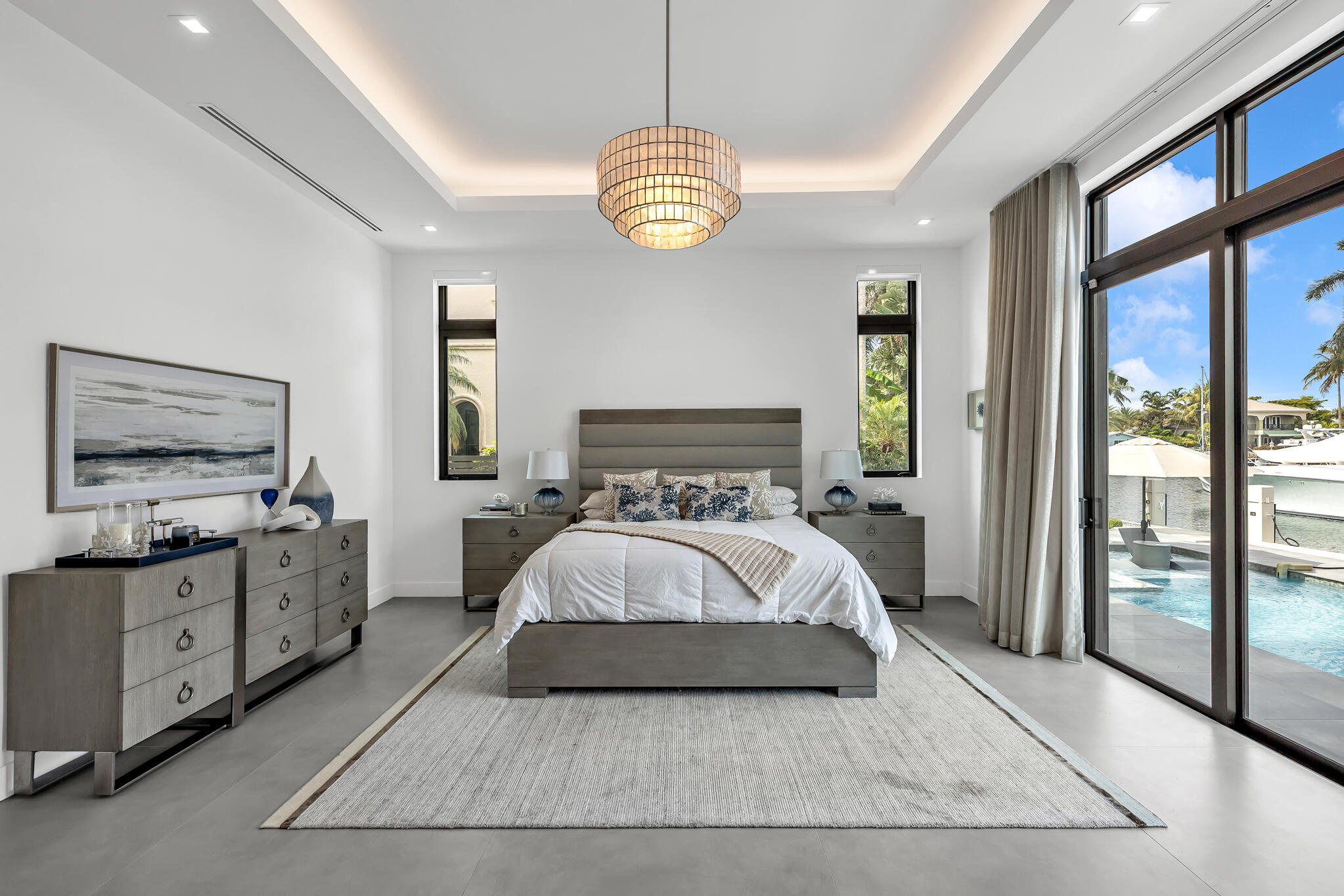 3711 Northeast 30th Avenue Lighthouse Point, FL 33064 - Photo 36 of 57 a spacious bedroom with a bed and a large window