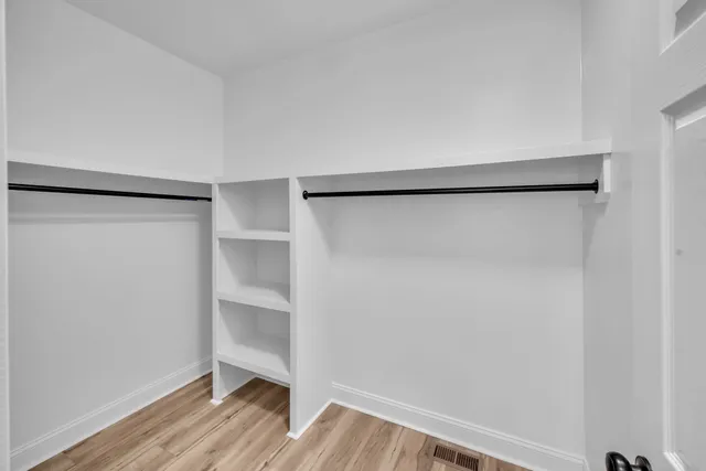 a view of an empty walk in closet