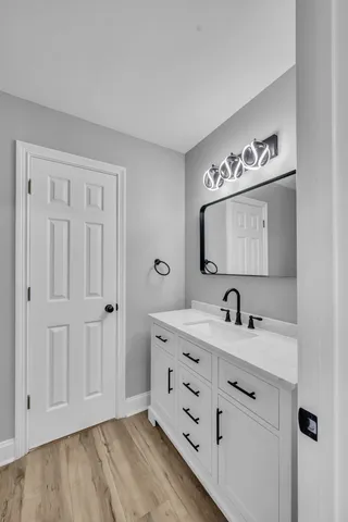 a bathroom with a sink and a mirror