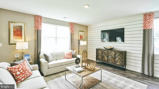 a living room with fireplace furniture and a flat screen tv