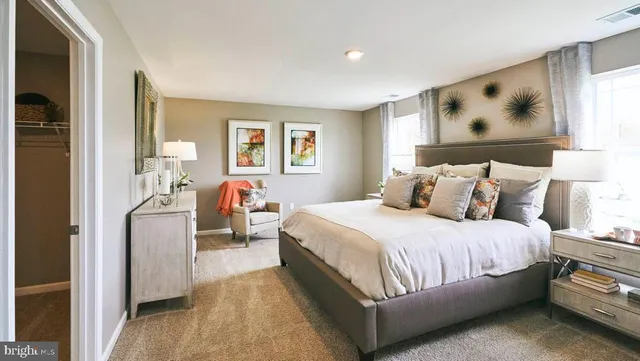 a bedroom with bed and window