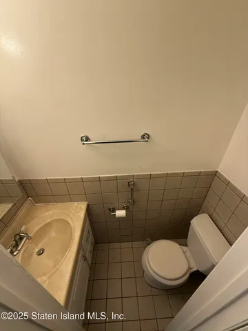 a bathroom with a toilet and a sink