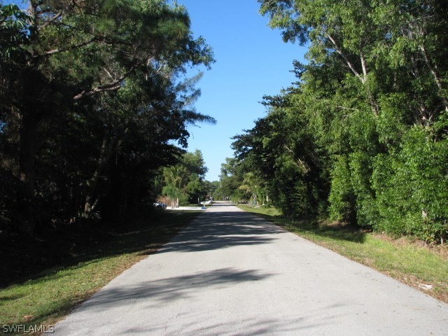 5775 Sea Bass Road Bokeelia, FL 33922 - Photo 5 of 5 a view of path and yard