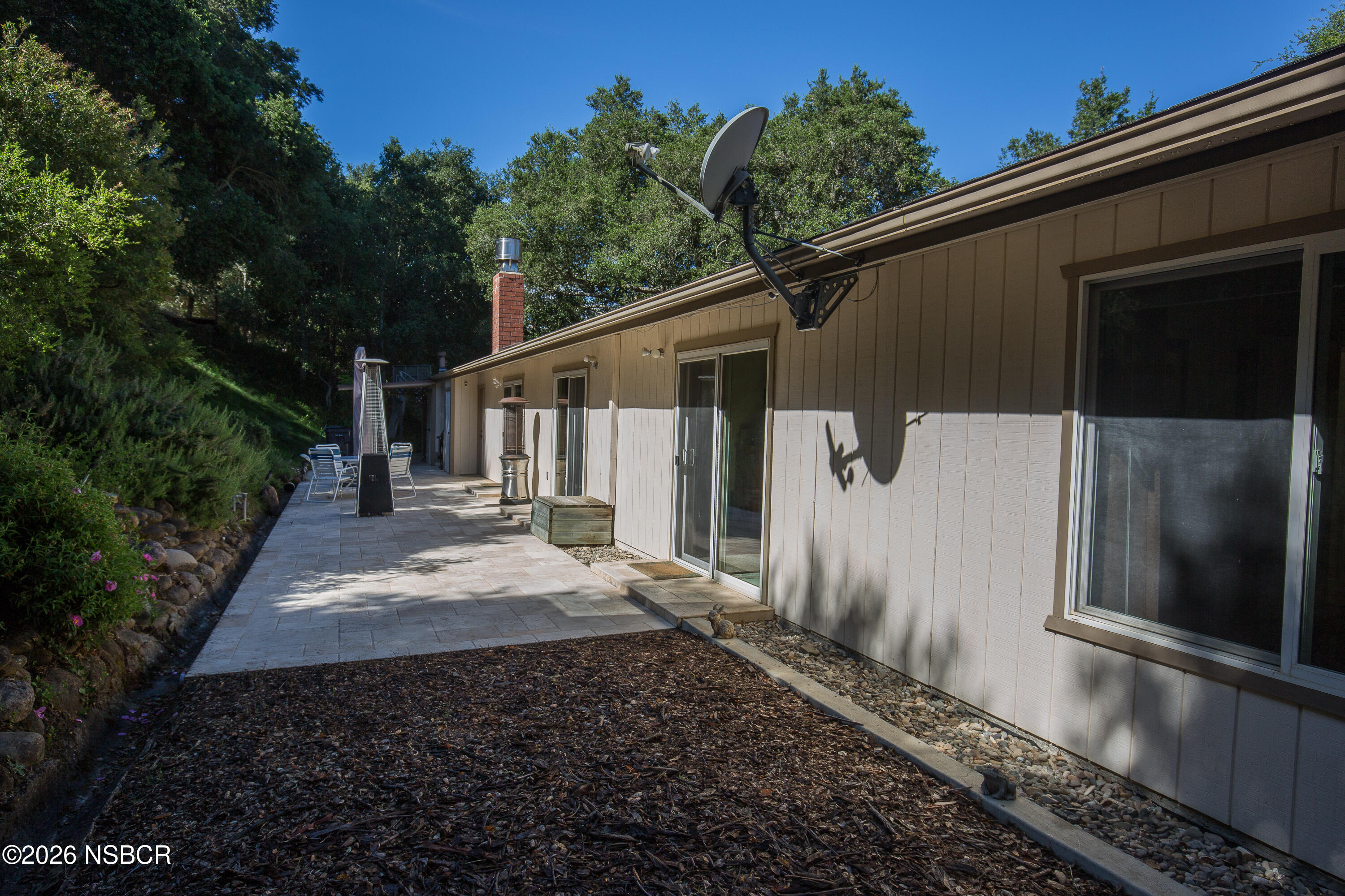 850 Fredensborg Canyon Road Solvang, CA 93463 - Photo 20 of 26 a backyard of a house with a garden