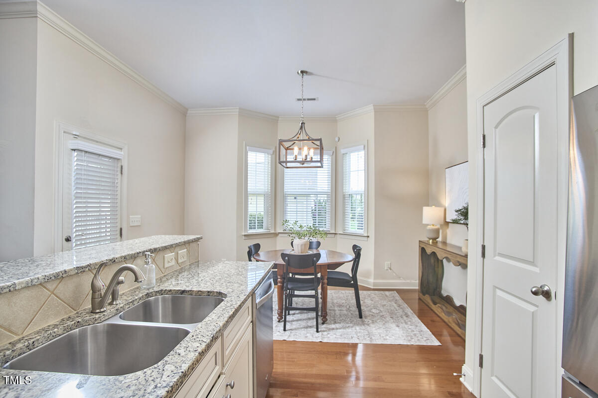 808 Historian Street Raleigh, NC 27603 - Photo 23 of 51 a kitchen with a sink cabinets and outdoor view