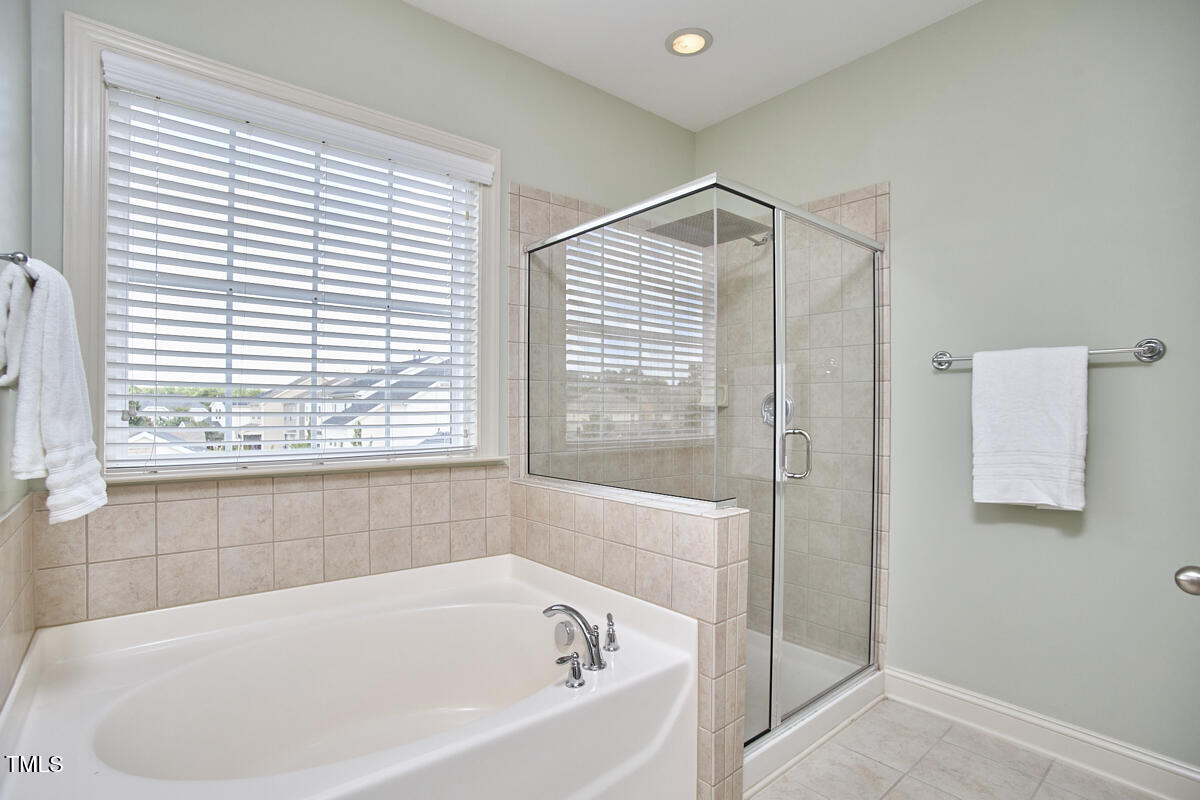 808 Historian Street Raleigh, NC 27603 - Photo 33 of 51 a white bath tub sitting next to a window