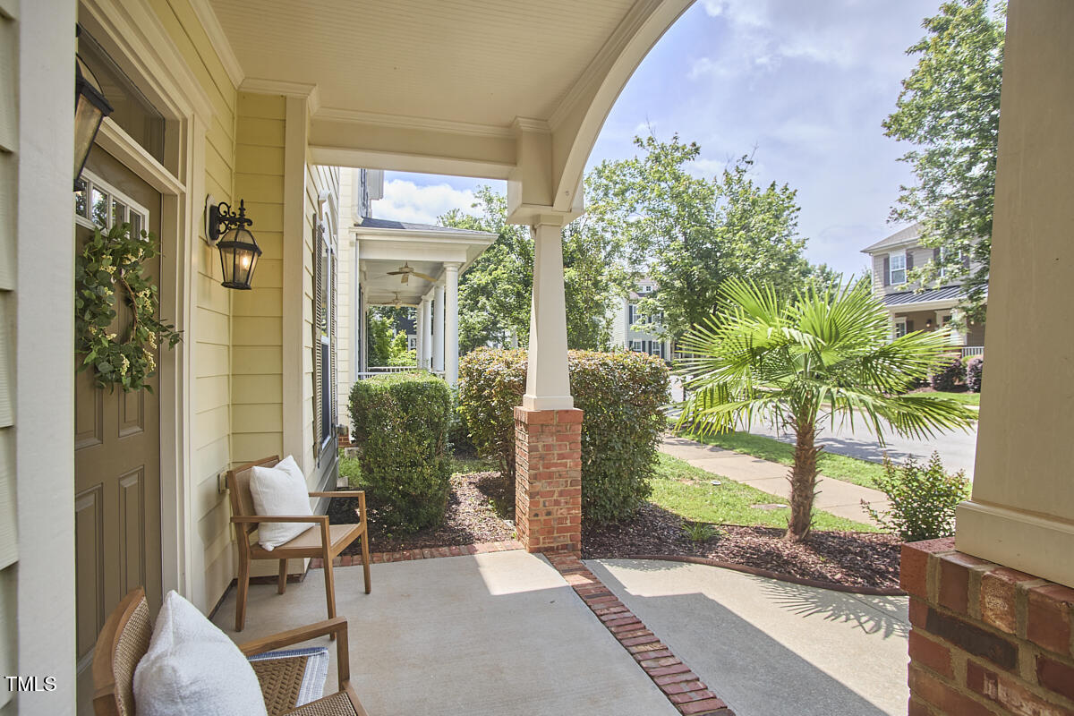 808 Historian Street Raleigh, NC 27603 - Photo 4 of 51 a view of a porch with chairs and potted plants