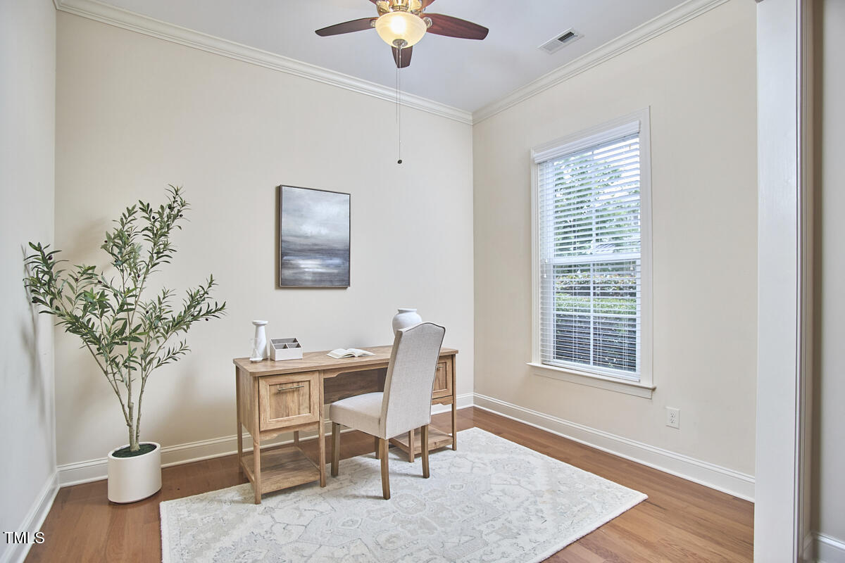 808 Historian Street Raleigh, NC 27603 - Photo 7 of 51 a workspace with furniture and a window