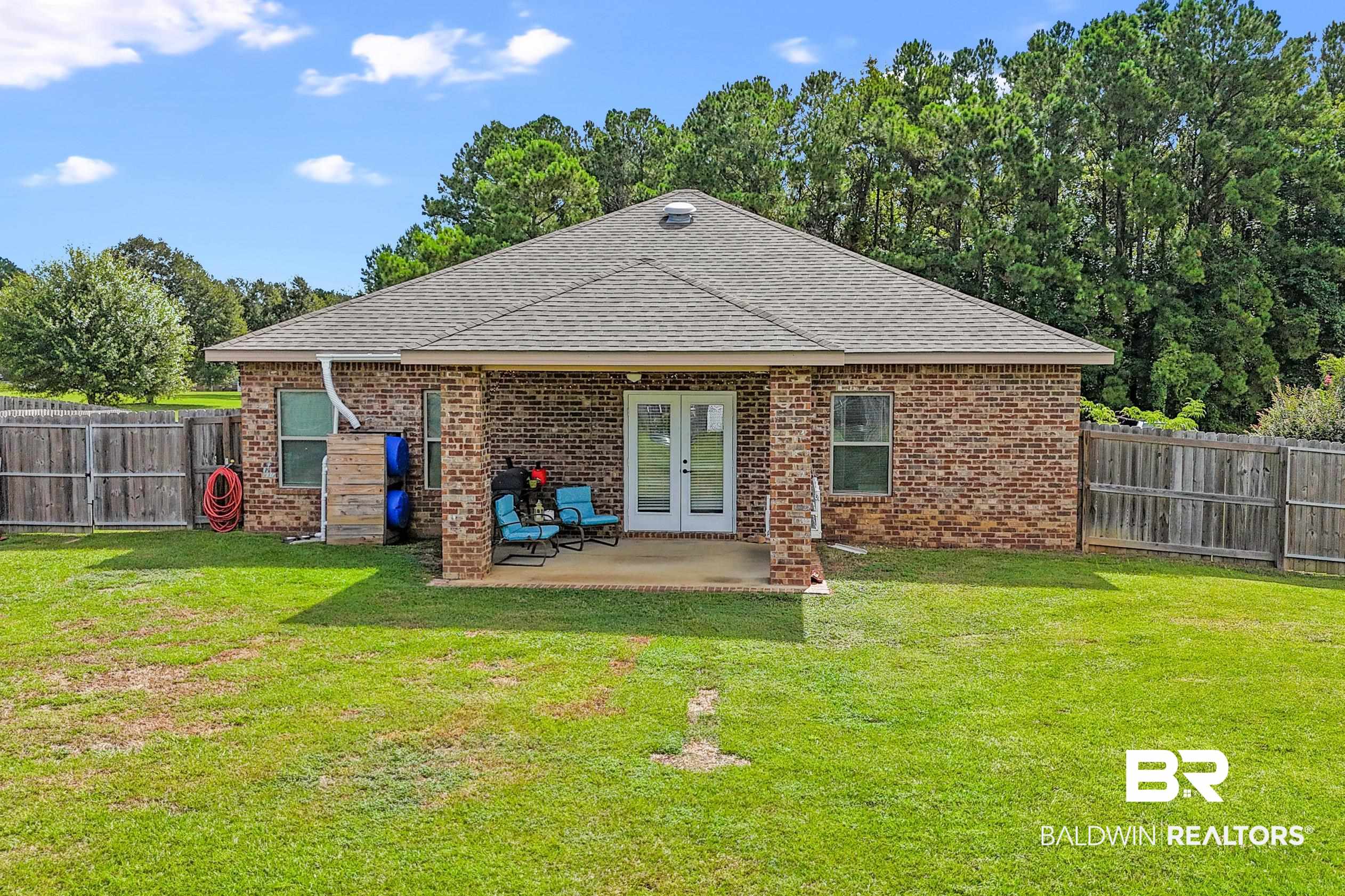745 Bonaventure Street Fairhope, AL 36532 - Photo 30 of 36 Back of house featuring a yard and a patio