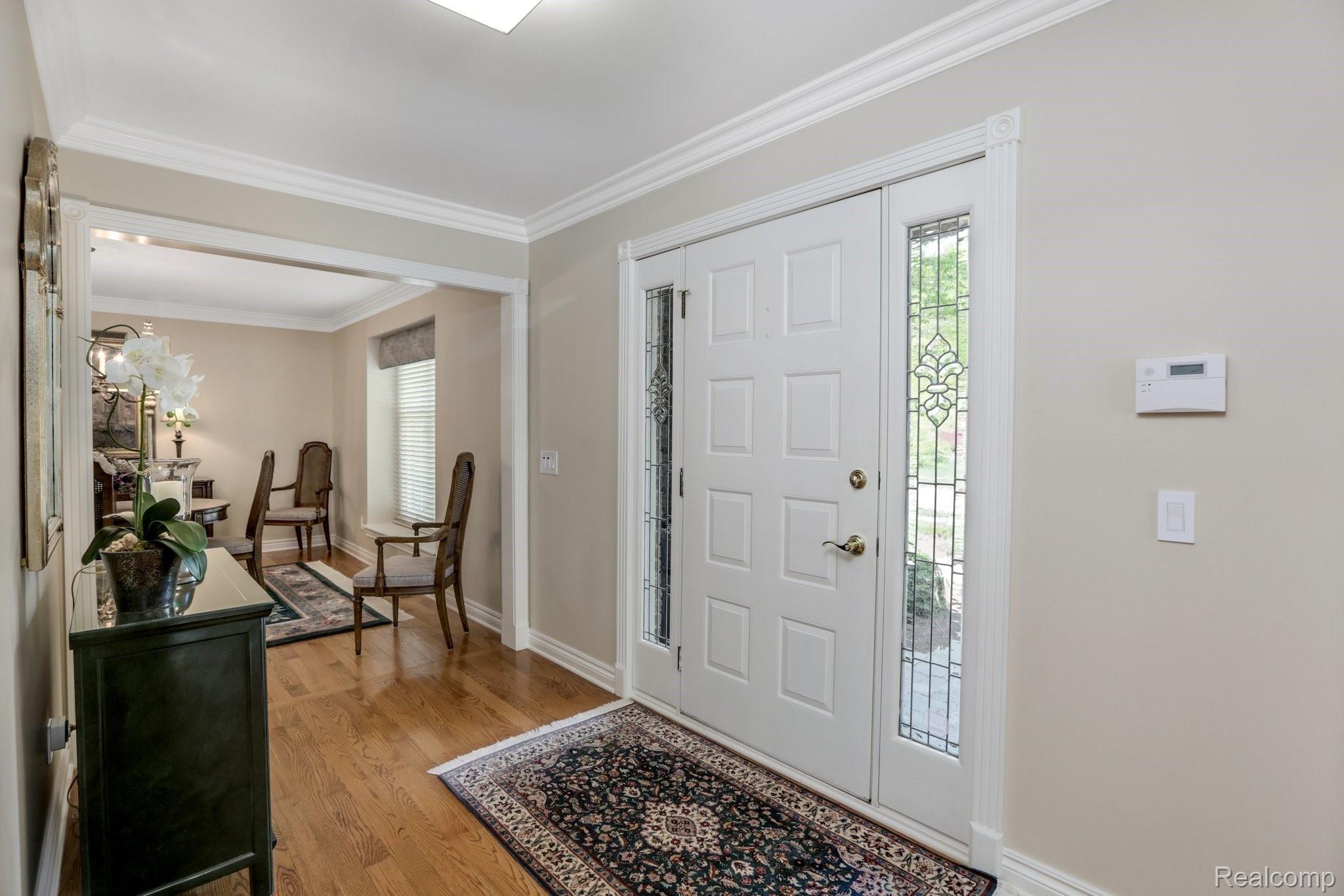 4808 Rivers Edge Drive Troy, MI 48098 - Photo 4 of 40 Spacious foyer and refinished hardwood floors throughout