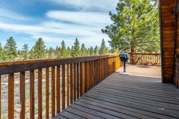 a view of deck with wooden floor and seating space