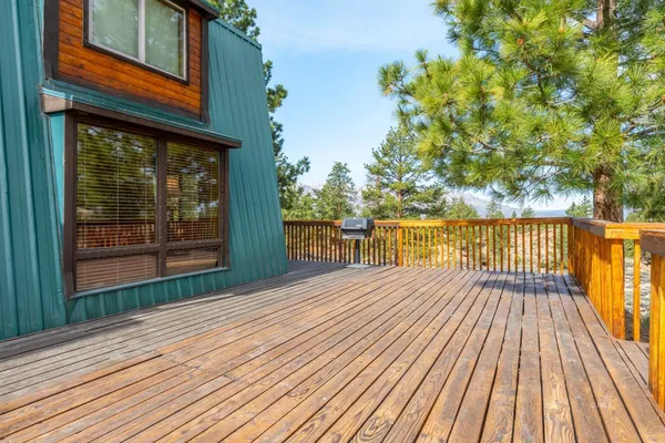 a view of balcony with wooden floor