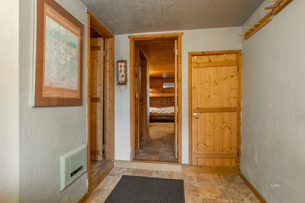 a bedroom with a bed and a table