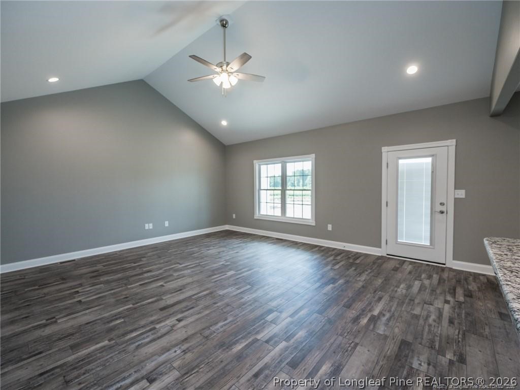 1102 West Carthage Road Lumberton, NC 28360 - Photo 8 of 41 a view of an empty room with wooden floor and a window